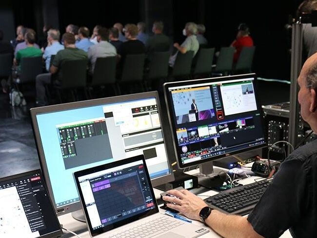 Technical team setting up cameras for a hybrid live event in Munich.