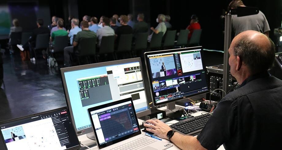Technical team setting up cameras for a hybrid live event in Munich.