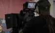 Multiple cinematic 4K cameras facing a stage for a corporate hybrid event streaming production in Munich.